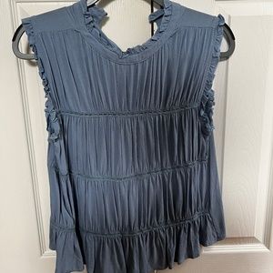Blue sleeveless blouse